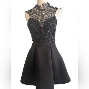 Windsor black formal party dress with lace front gold accents tie back. Medium